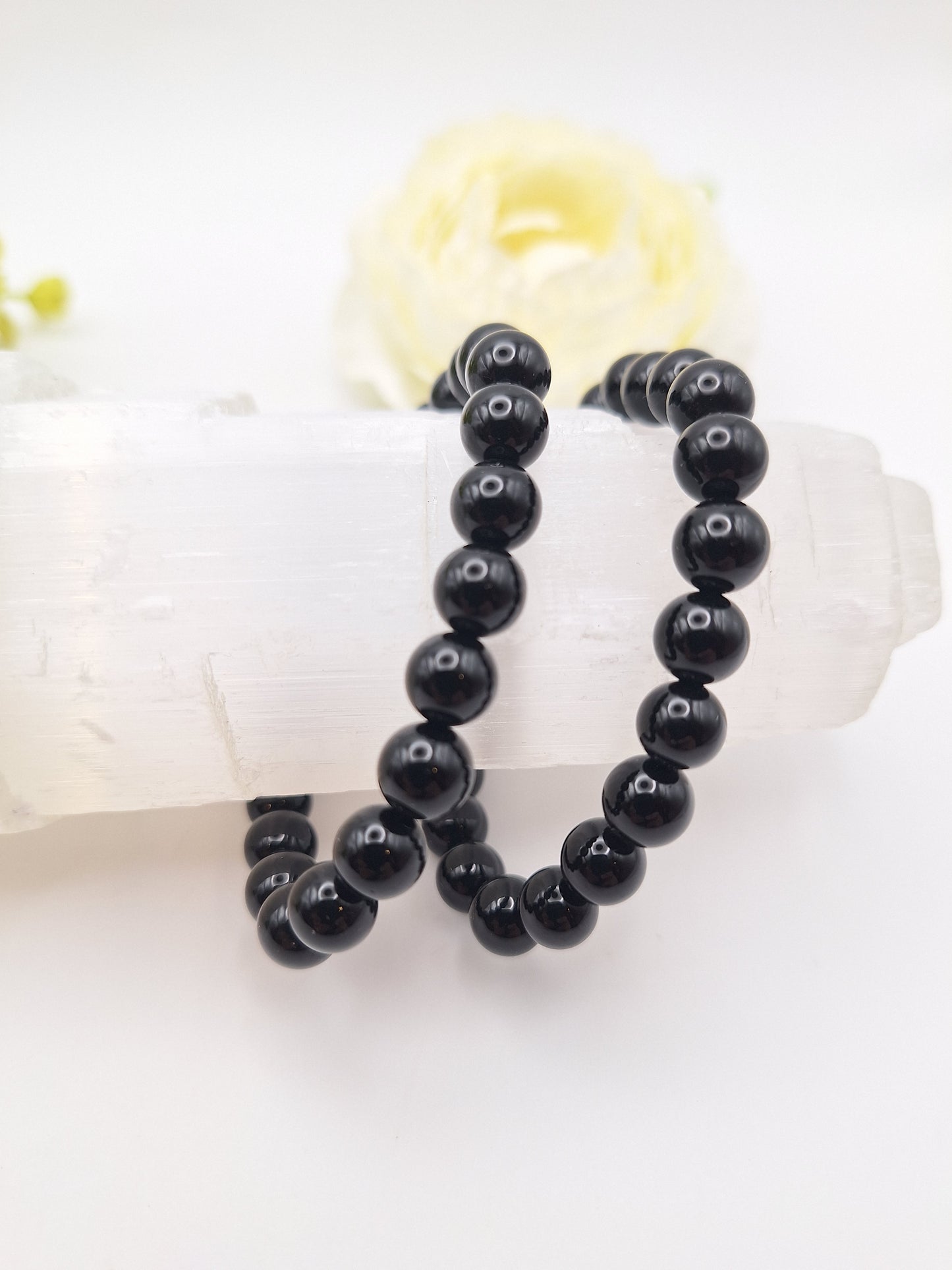 8mm black obsidian bracelet made from genuine volcanic glass. A powerful grounding and protection stone, promoting creativity and Root Chakra balance. Stretchy, unisex design.