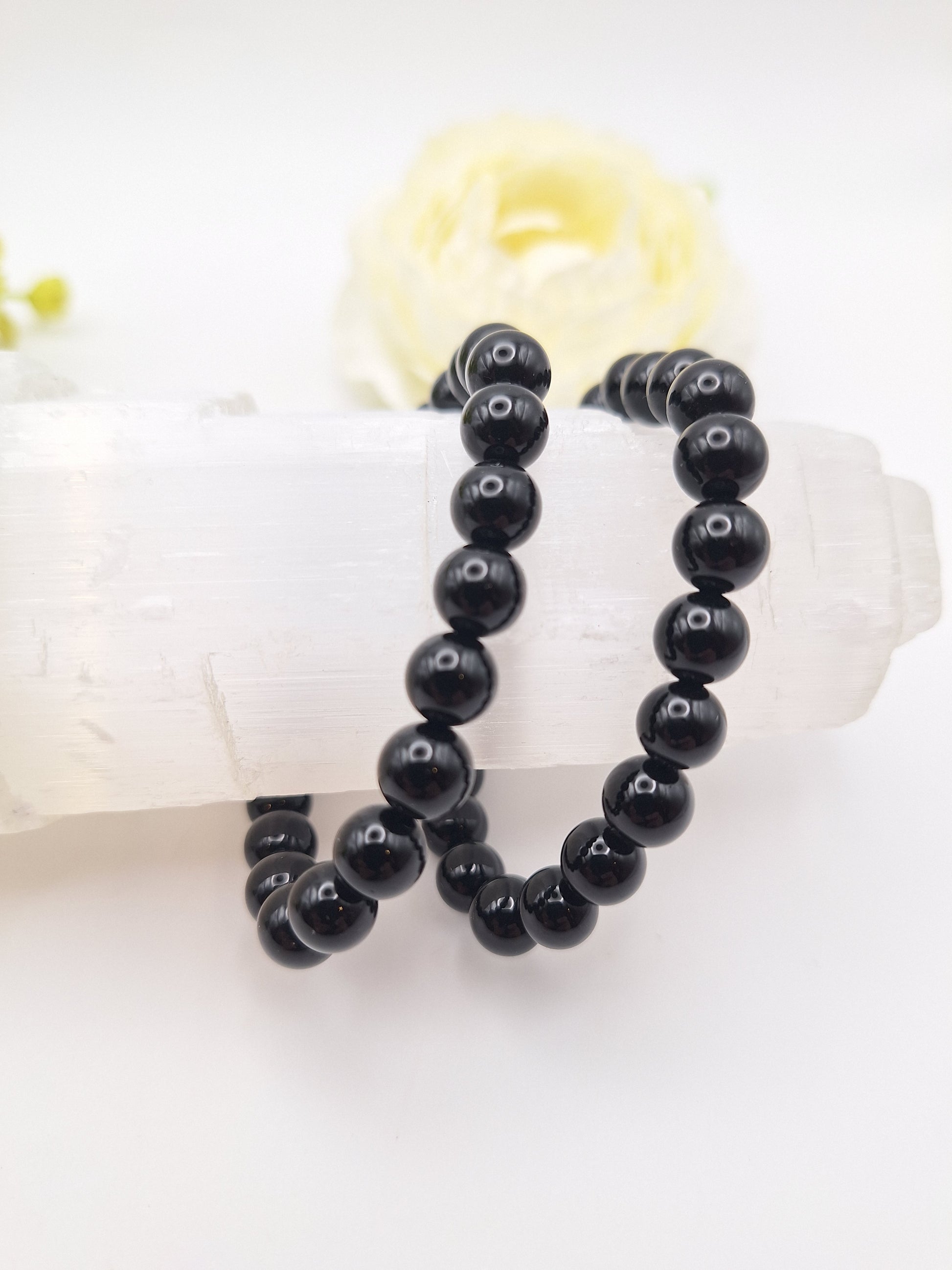 8mm black obsidian bracelet made from genuine volcanic glass. A powerful grounding and protection stone, promoting creativity and Root Chakra balance. Stretchy, unisex design.