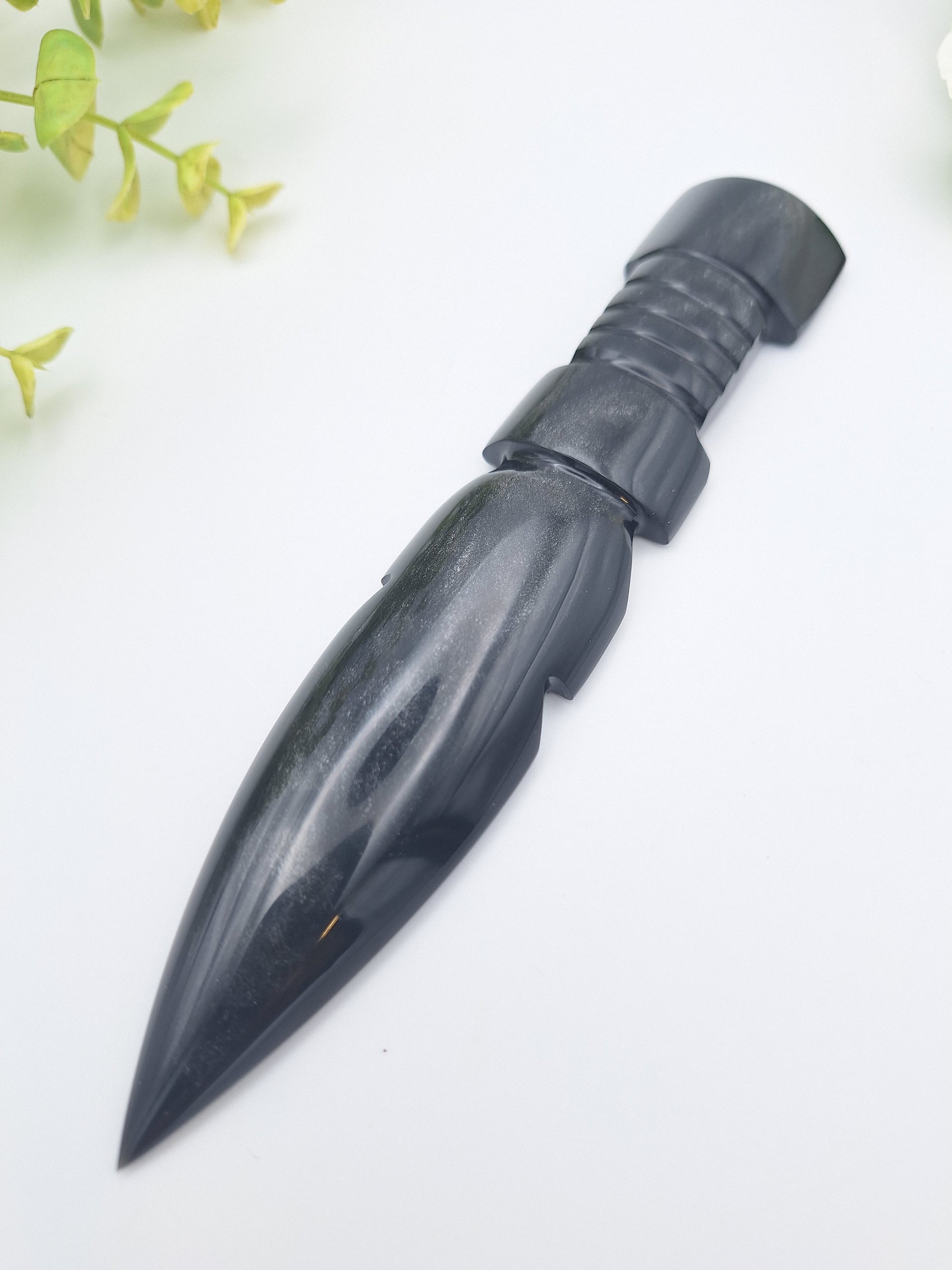 Black Obsidian decorative dagger at a slight angle, emphasizing the natural sheen of the volcanic glass blade.