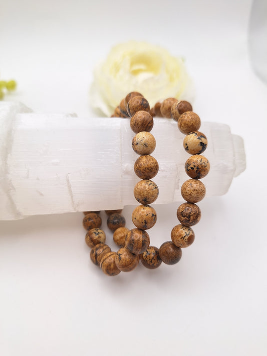8mm picture jasper stretch bracelet in earthy brown tones. A grounding gemstone that fosters mindfulness, emotional regulation, and connection to Mother Earth. Root Chakra support.