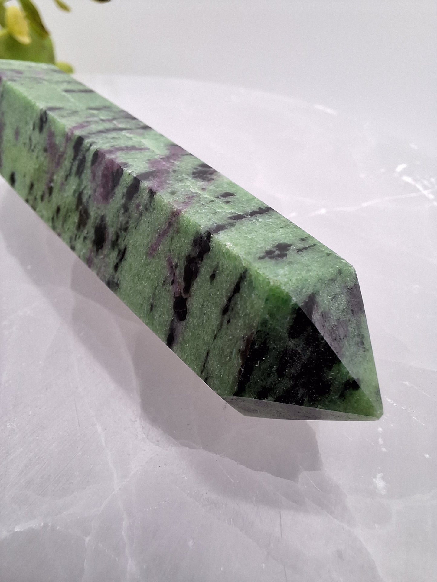 Side view of ruby zoisite tower showcasing rich colors