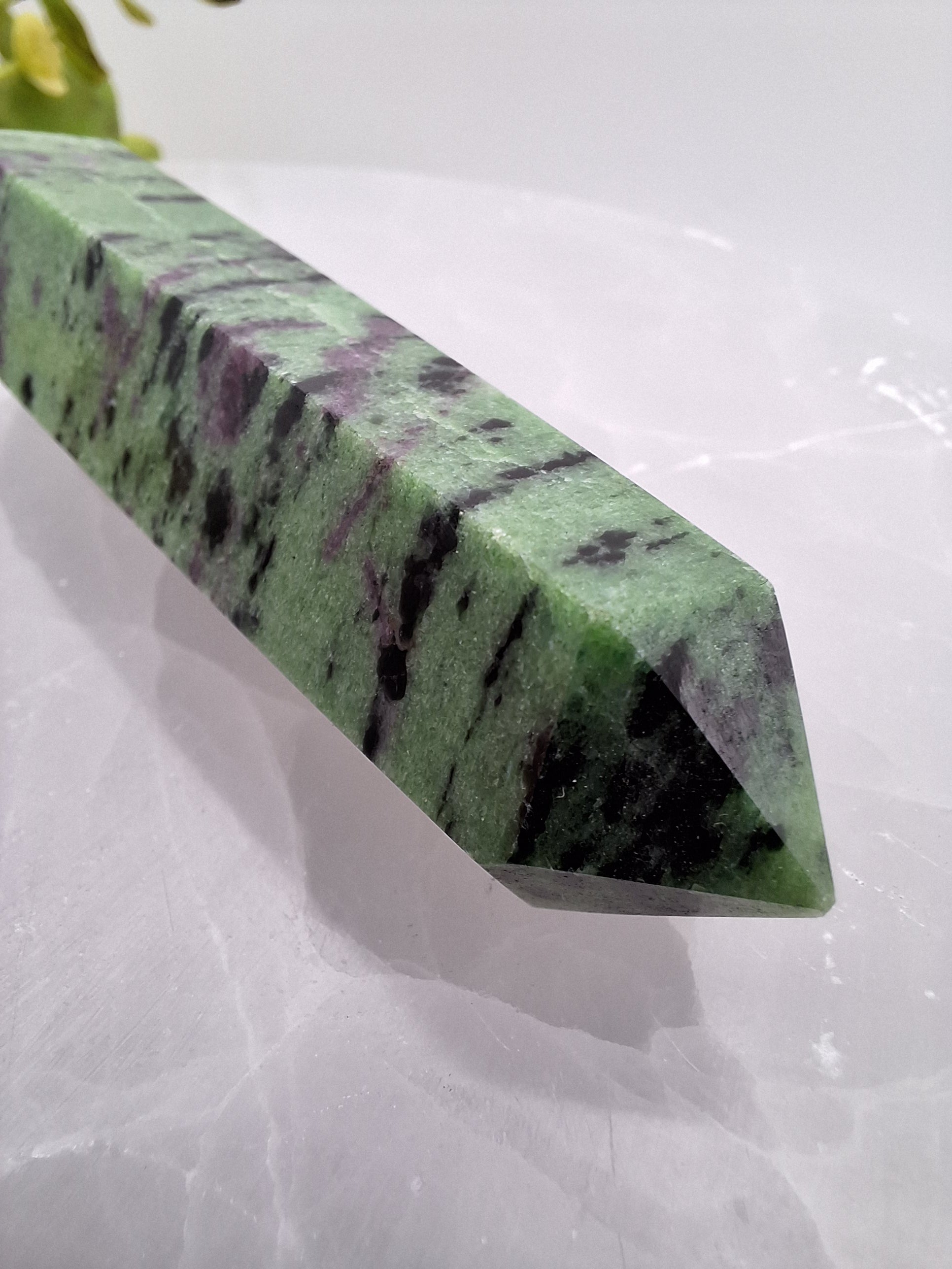 Side view of ruby zoisite tower showcasing rich colors